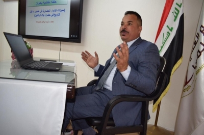 A teacher at the University of Kirkuk participates in a scientific symposium on the mechanism of dealing with cuneiform writings at the University of Samarra