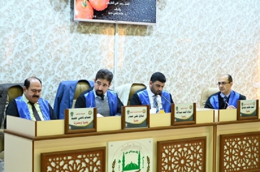 A faculty member from the University of Kirkuk participates in the discussion of a master&#039;s thesis at the University of Samarra