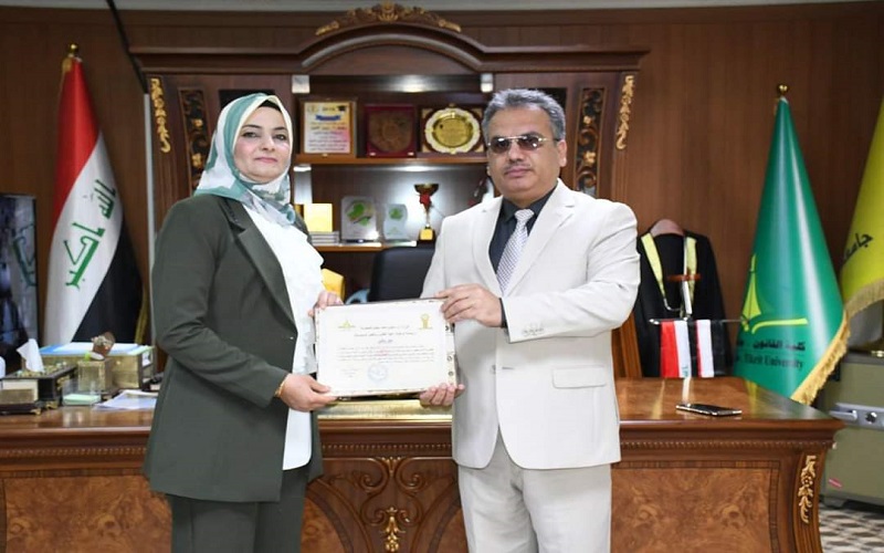 A teacher in the College of Law and Political Science participates in a membership in the committee discussing a doctoral thesis in the College of Law at Tikrit University