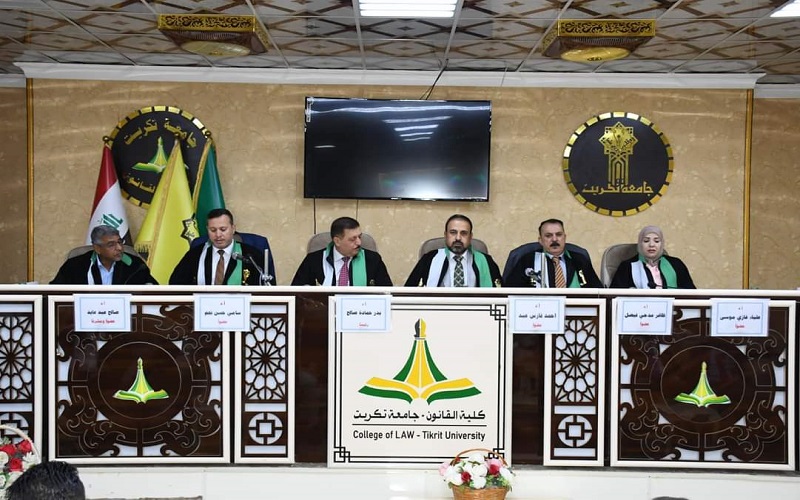 A teacher at the College of Law and Political Science participates in a membership in the committee discussing a doctoral thesis at the College of Law at Tikrit University