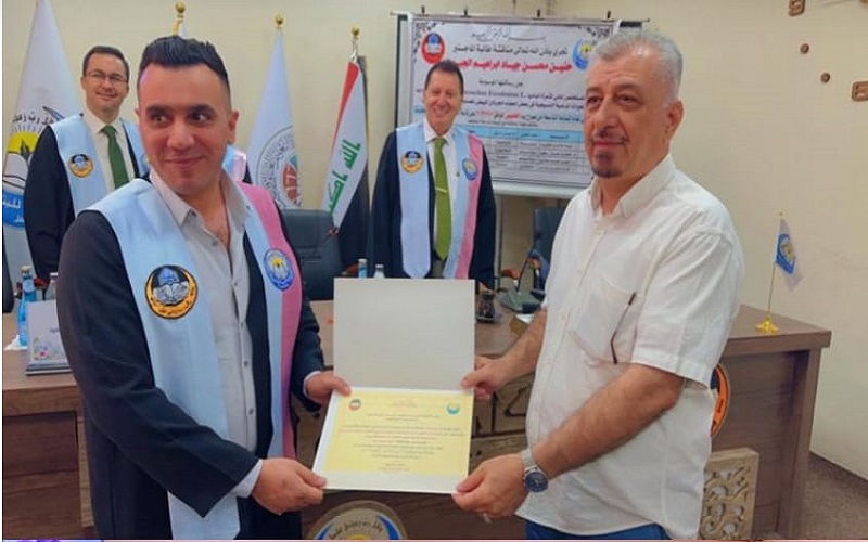 A lecturer from the College of Science/University of Kirkuk participates in a master’s thesis discussion committee at the University of Mosul