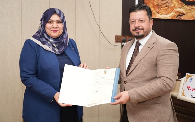 تدريسية من جامعة كركوك تشارك في مناقشة أطروحة دكتوراه في جامعة تكريت