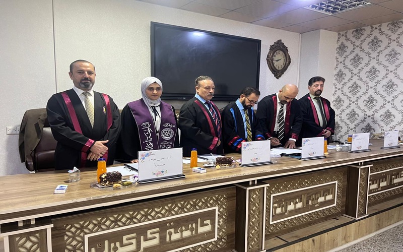  Assistant Dean of the College of Science for Scientific Affairs / University of Kirkuk examines a master's thesis 