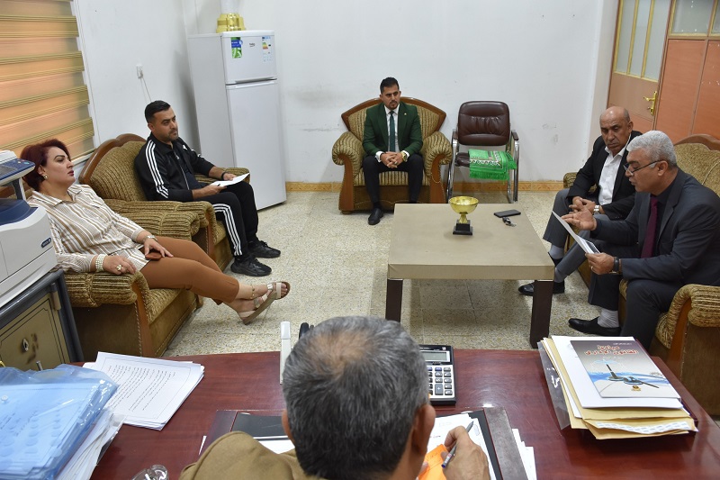 The Dean of the College of Physical Education and Sports Sciences holds a meeting with members of the Scientific Committee