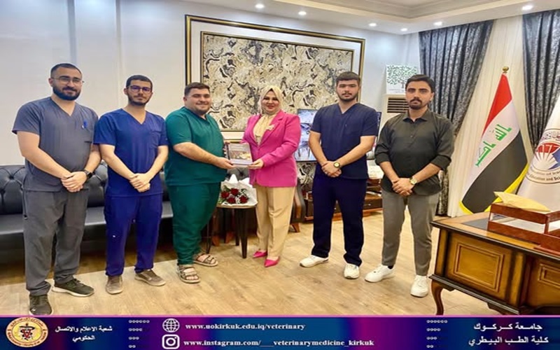 The Dean of the College of Veterinary Medicine at the University of Sulaimani presents a collection of scientific books.